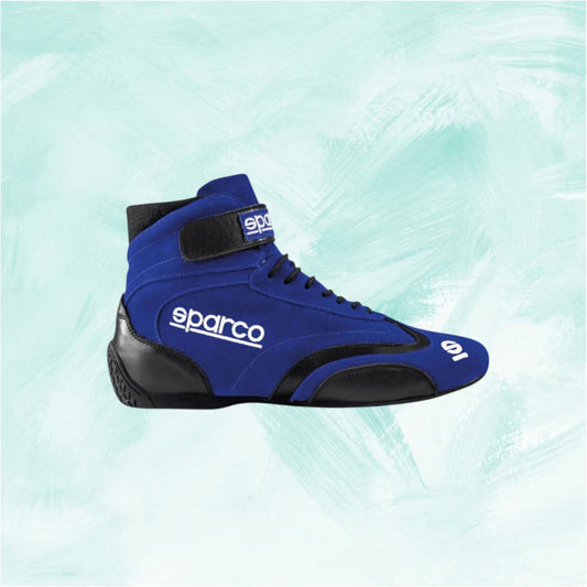 Blue racing shoe with black accents on a light blue background